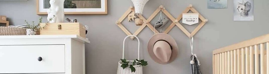 Nordic Scandi Nursery with expanding accordion coat rack on grey walls